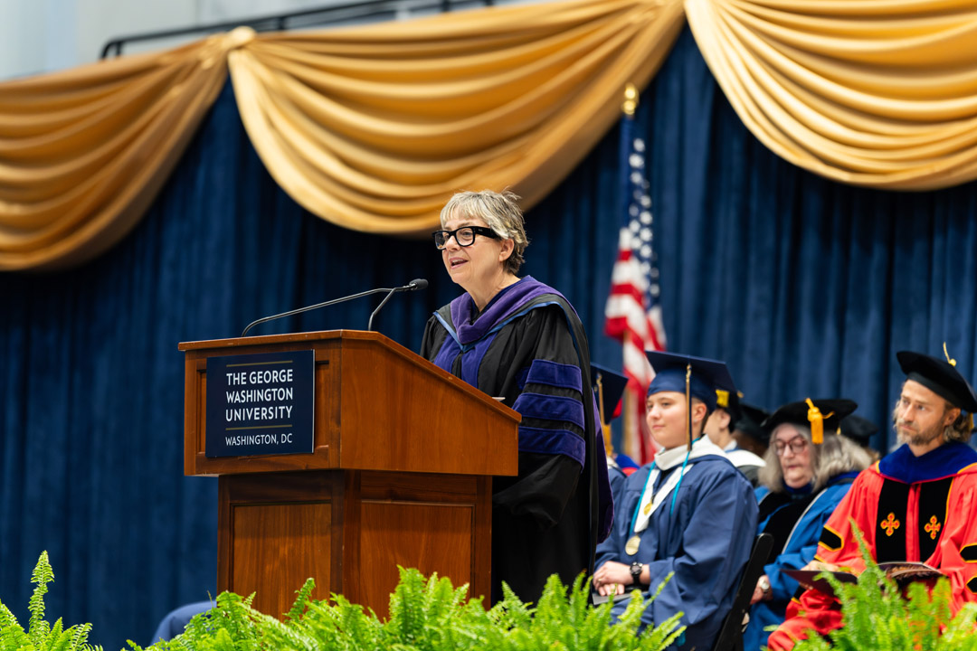 Toni Marsh speaks at podium