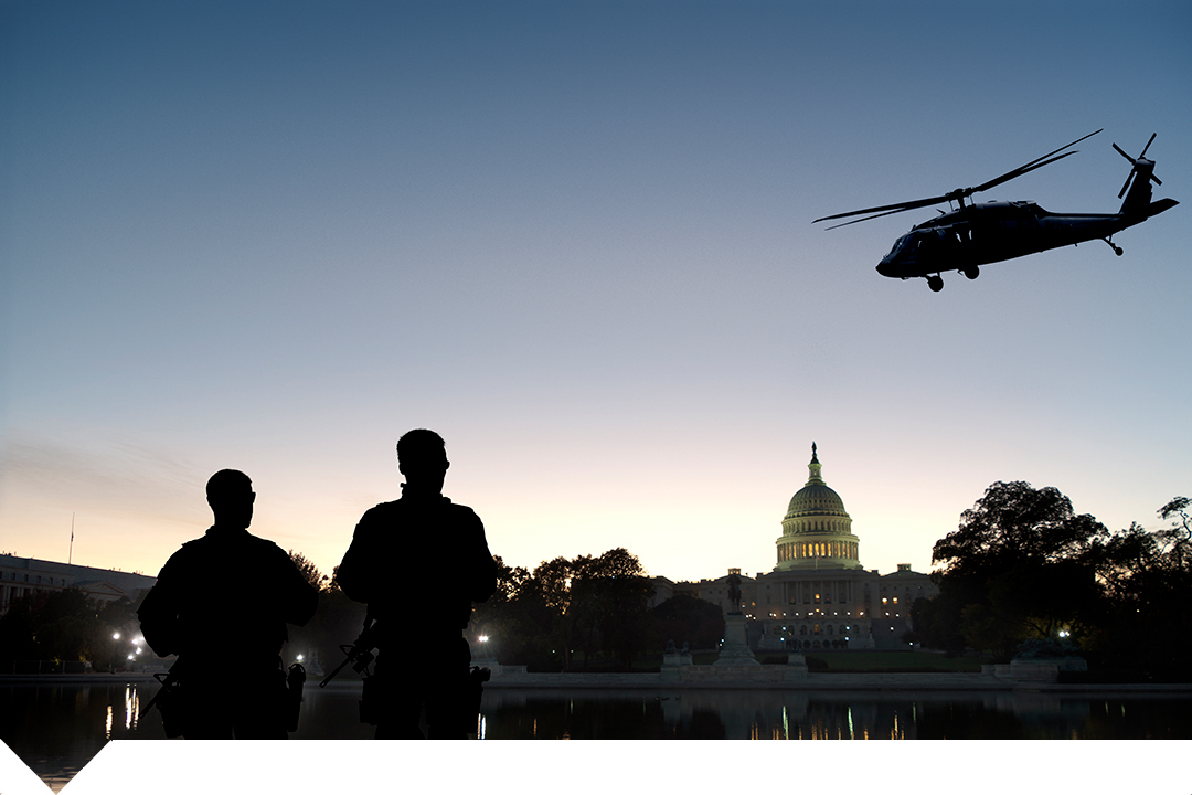 Security personnel near White House with helicopter