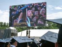 graduation ceremony with cap and gowns