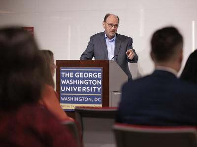Larry Parnell at podium with audience