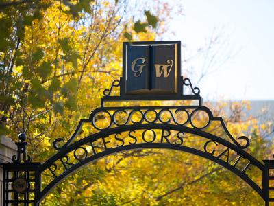 GW Professors Gate with fall leaves and trees