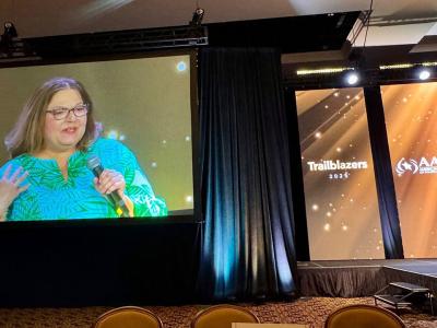 Nancy Bocksor speaking onstage
