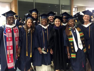 Paralegal student group in cap and gown attire
