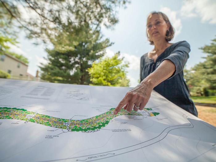 Darlene Robbins with map of the project