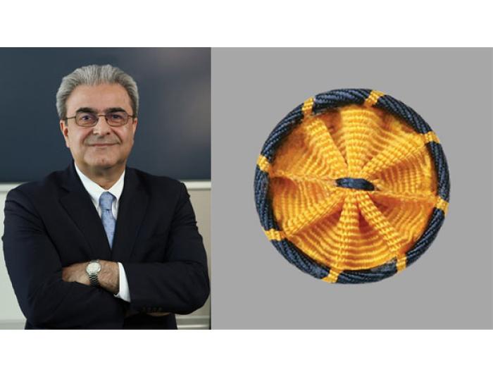 Eskandarian in a suit with AAAS Fellow rosette pin