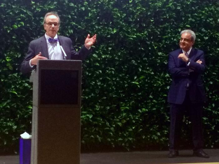 GSEHD Dean Michael Feuer speaks at the reception April 3 in honor of former dean Ali Eskandarian (right).