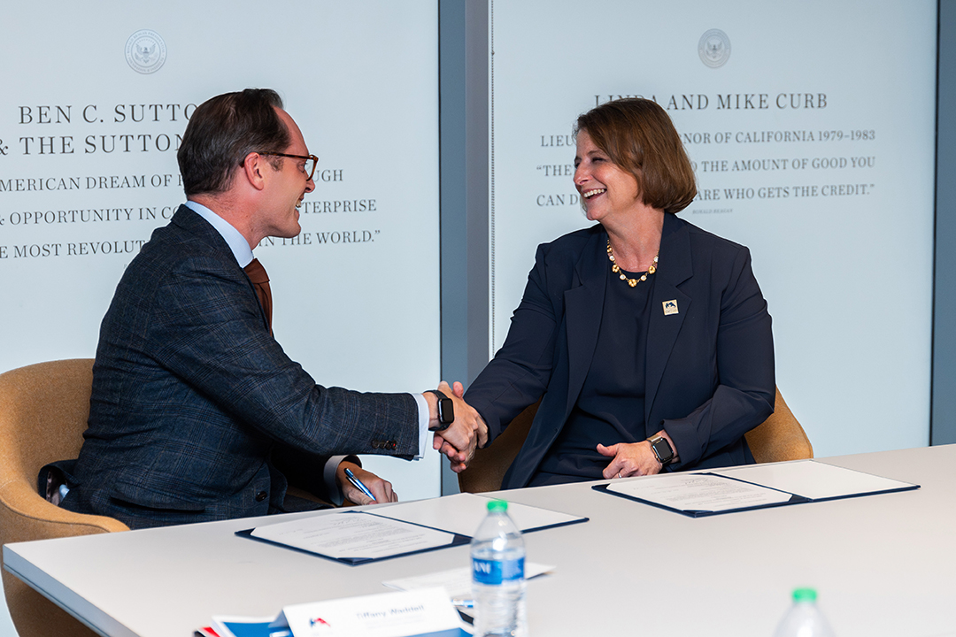 Roger Zakheim, director of the Ronald Reagan Institute with Liesl Riddle, dean of CPS.