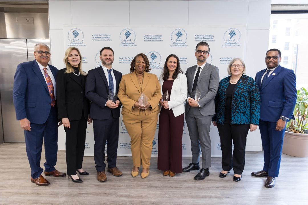Cafritz Award winning team with James Robinson, Jane L. Cafritz, President Ellen Granberg and Director Charles Hall Jr. in front of step-and-repeat