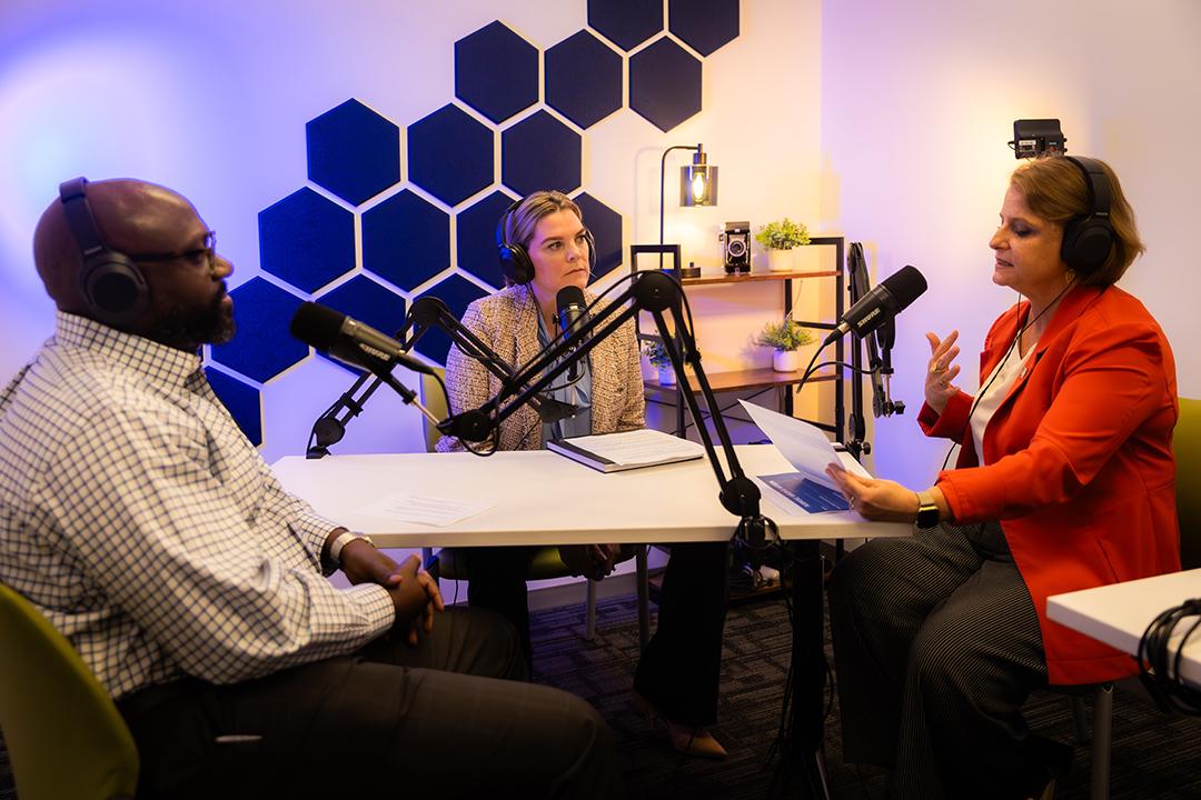 Podcast hosts Amanda Gillepsie and Luke Kasim interview Dean Liesl Riddle