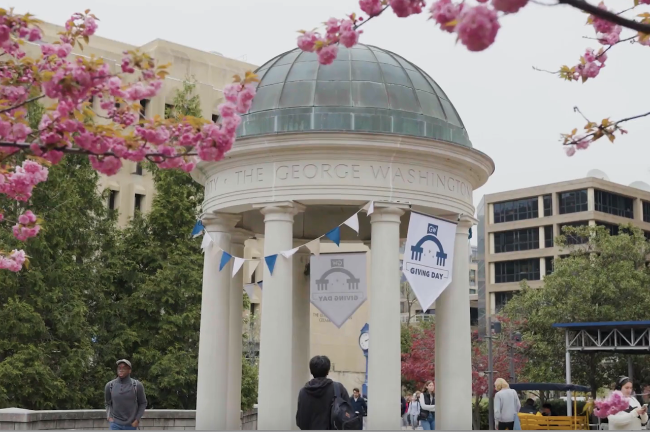 GW plaza with cherry blossoms and GW banners