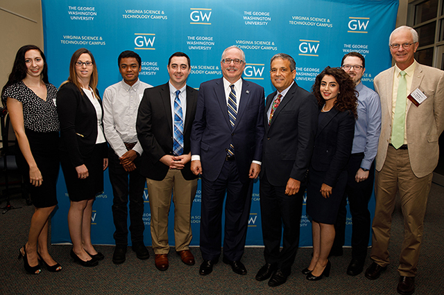 GW cyber students with administrators