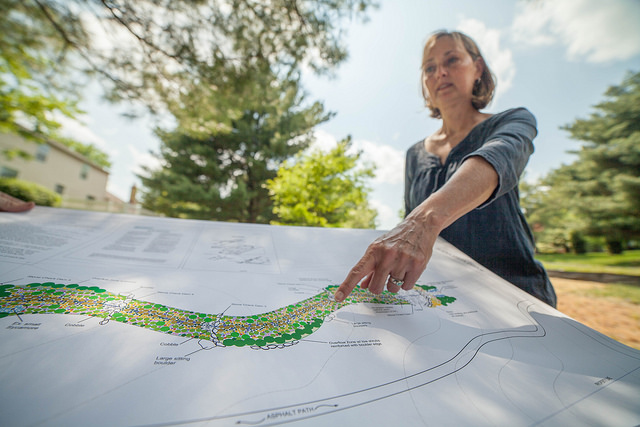 Darlene Robbins with map of the project