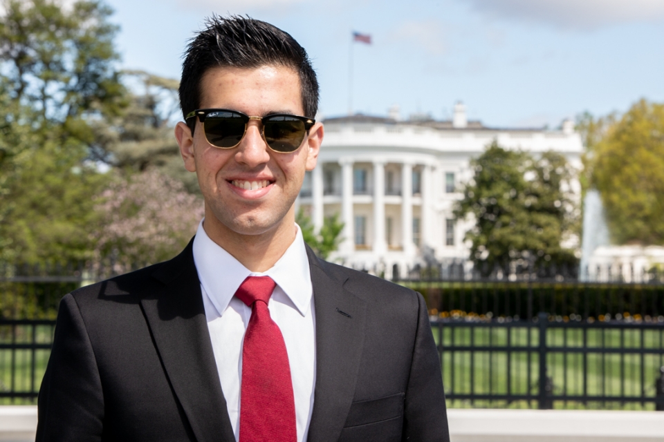 Adam Brown, GSPM '19, pictured in front of the White House