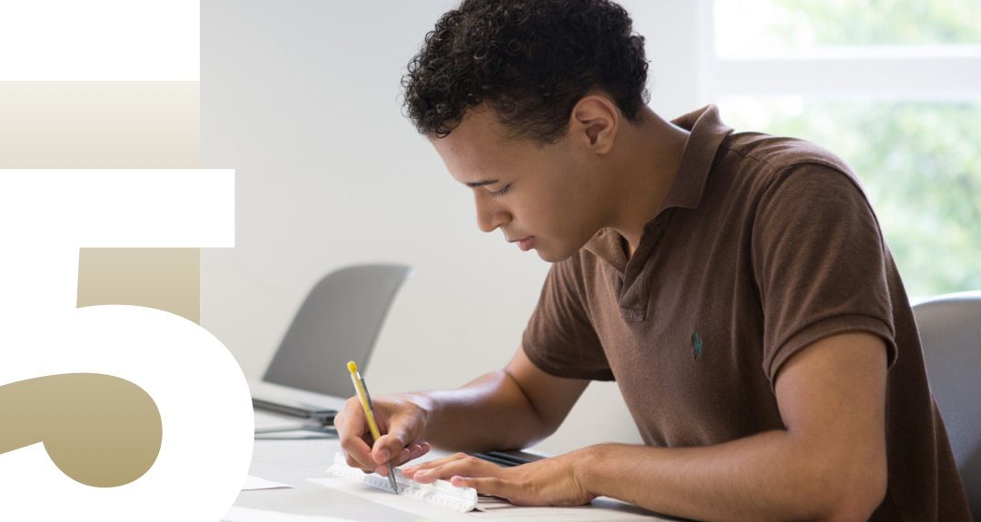 5 Master's Degrees, number 5 with man sitting writing