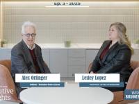 Alex Orfinger and Lesley Lopez sitting in chairs opposite one another