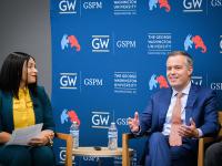 From left to right: Monique Chouraeshkenazi speaks with Matt Rhoades. 