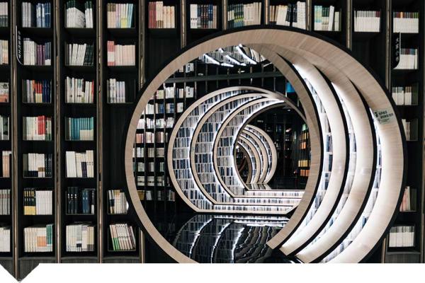 Books on shelves with spiral bookcase
