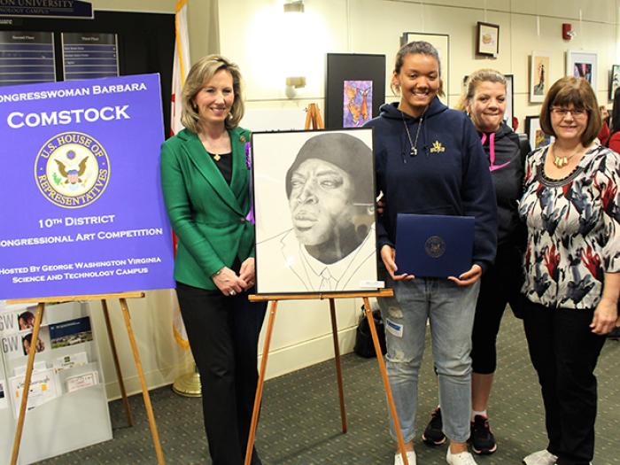 Rep. Comstock with winner of Congressional Art Show