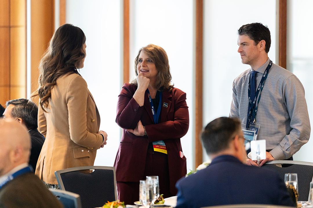 VIP luncheon participants talking amongst themselves at 2025 Cybersecurity Conference