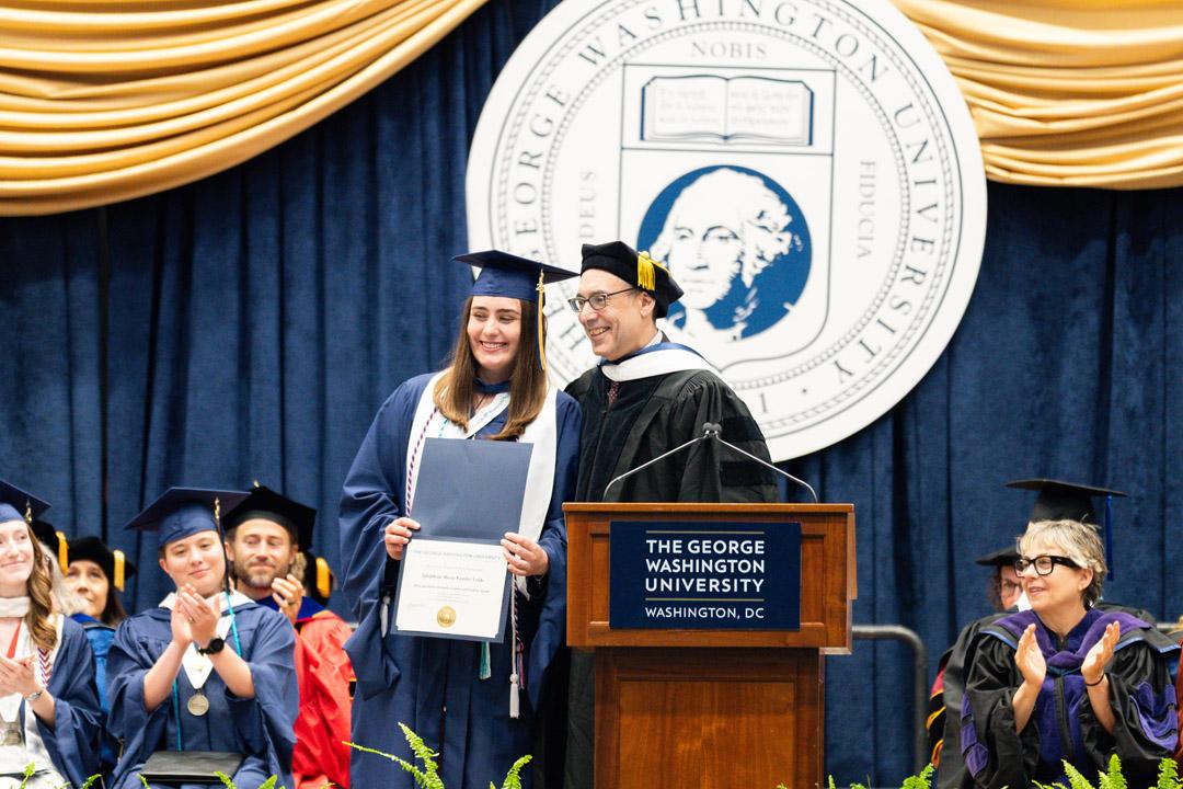 Adolphina Vander Velde and Matt Dallek stand together onstage