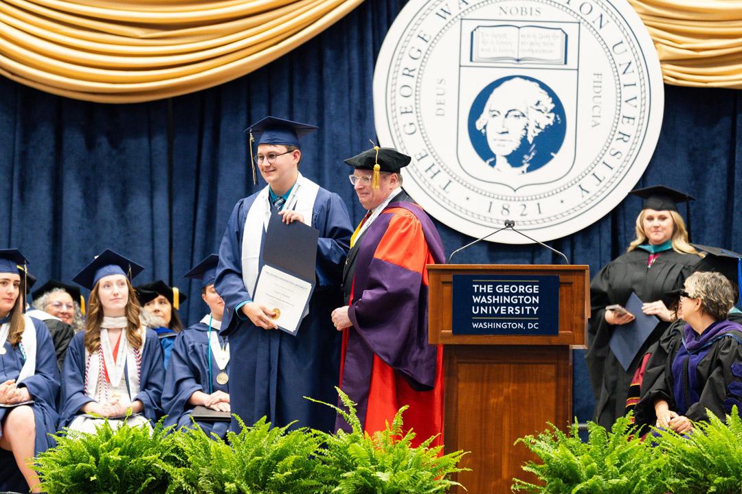 Logan J. Bennett and Scott White smile together onstage