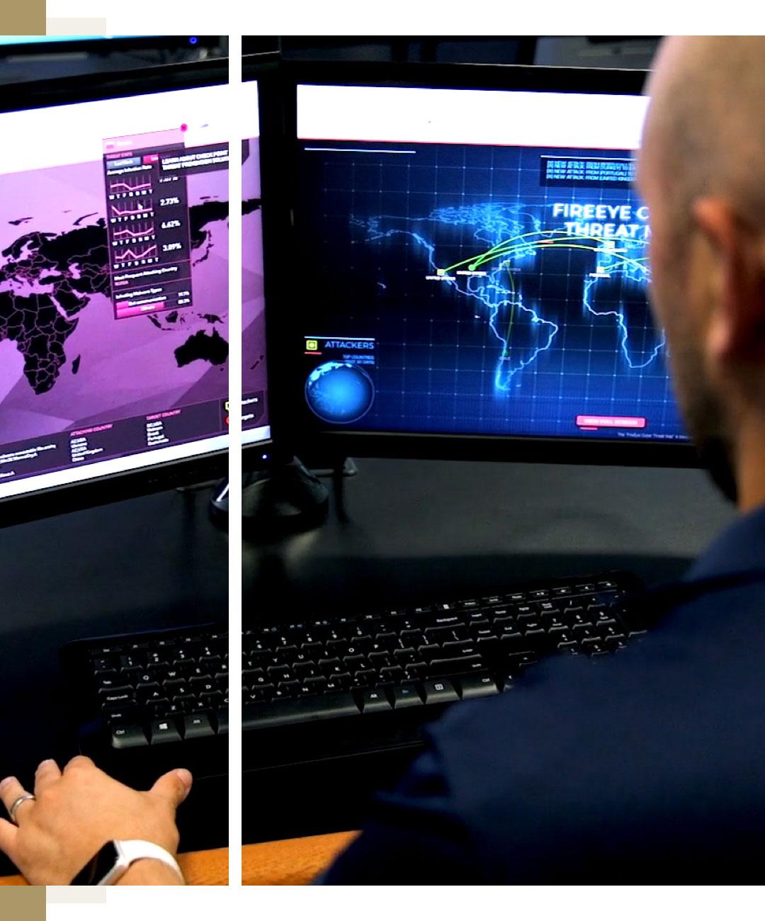 Man Looking at Computer Screens