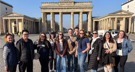 Students pose in front of the Brandenberg Gate in Berlin, Germany